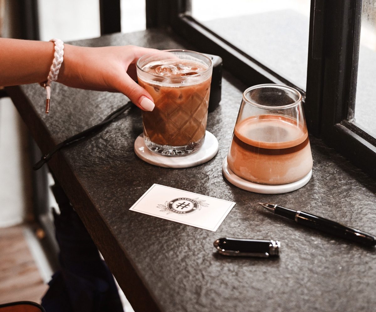 iced coffee with hashtag on business card content savvy