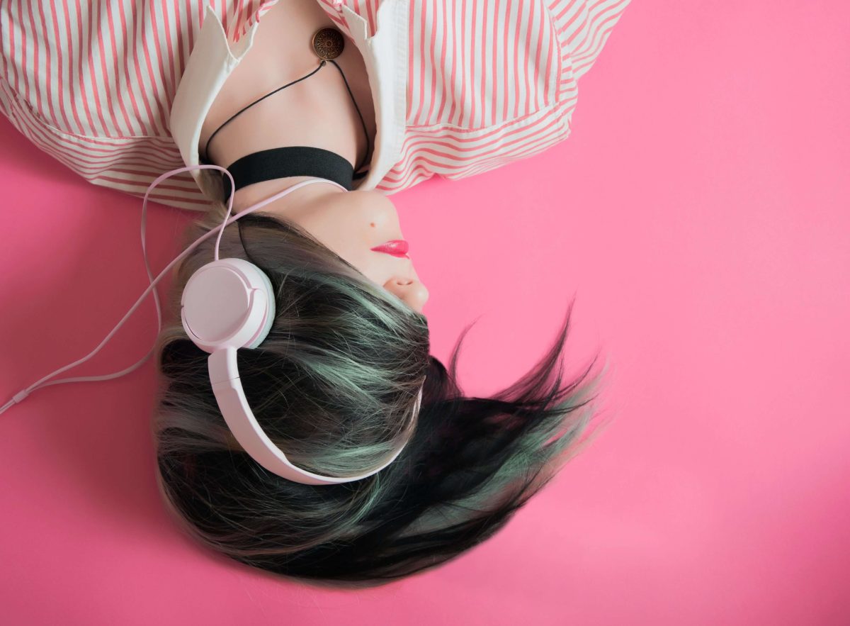 headphones on woman for playlist on finding inspiration